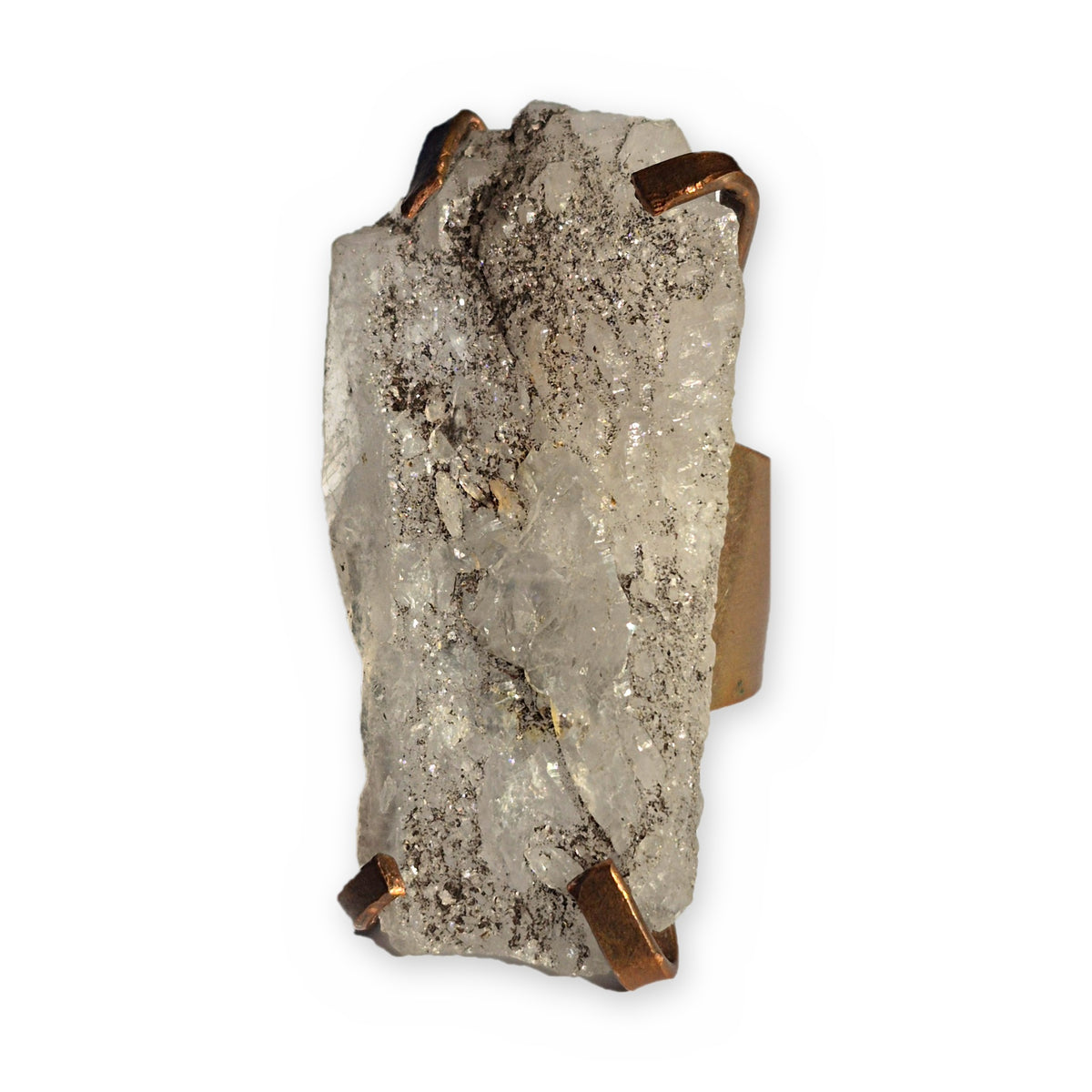Raw crystal quartz ring with hand-forged copper prongs and adjustable band on a white background