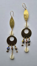 Brass leaf and cowrie earrings with cloisonné beads on a white background